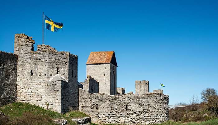 Visby Medieval Wall in Gotland with the Swedish flag. 