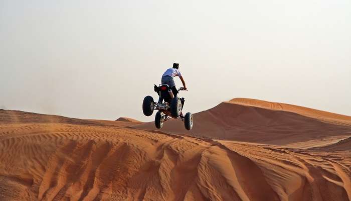 A majestic view of people enjoying a quad bike ride in Dubai
