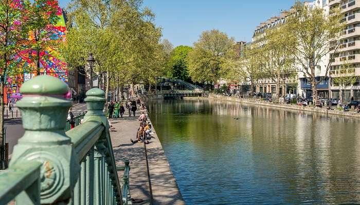 A delightful view of Canal St Martin which is one of the wonderful hidden gems in Paris