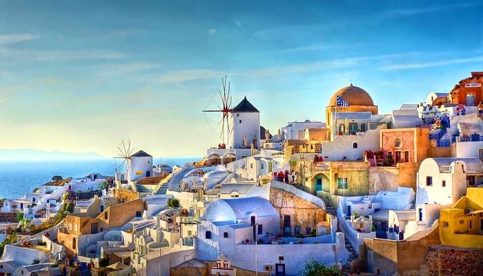 A majestic view of Oia, packed with bustling streets, Greet architecture