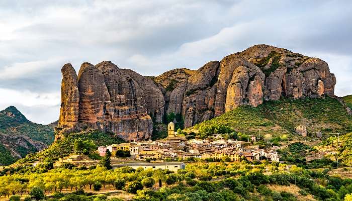 Guarded by the mighty “Mallos de Aguero”, the small village of Aguero is one of the most beautiful hidden gems in Spain