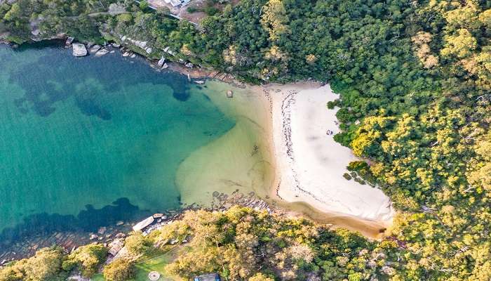  Sheltered by lush trees and rock pools, Collins Flat Beach is an almost picture-perfect location for a romantic picnic