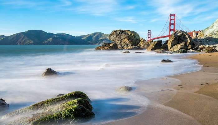 The stunning vista of the Golden Gate Bridge from Marshall’s Beach, among the hidden gems in San Francisco.