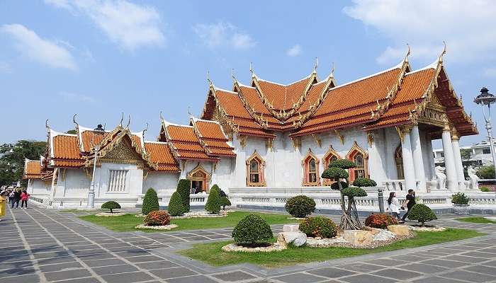 Exquisite golden decorations and a multi-tiered roof of Wat Benchamabophit.