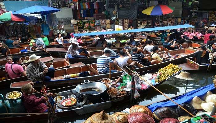 Traditional boats filled with fresh produce at Bang Nam Phueng Floating Market 
