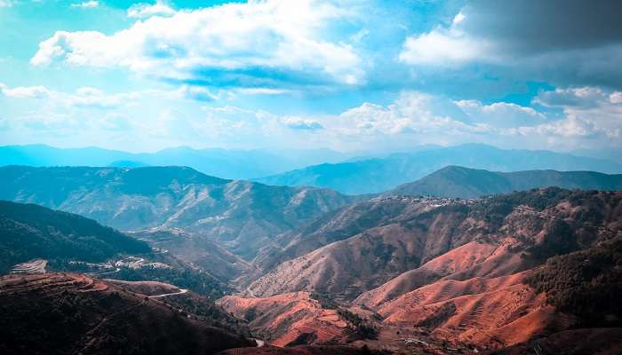 Sprawling view of the Himalayas from Chakrata Peak, a popular place to explore while trekking near Mussoorie.