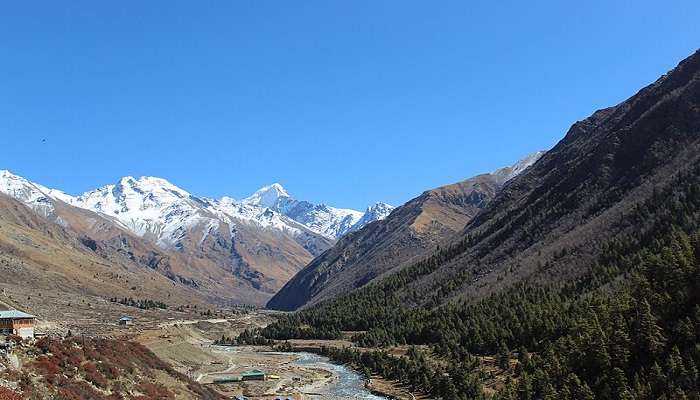 The scenic view of Chitkul village in the Himalayas during a Delhi to Spiti Valley road trip.