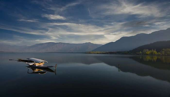  A soothing view of boat on Dal Lake and its surroundings