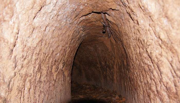 Exploring the famous Cu Chi Tunnel in Vietnam, a historical underground network used during the Vietnam War