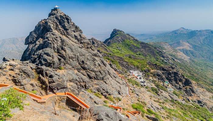 Gorgeous view of Girnar Hill enveloped by lush greenery and rocky terrain; the best place for trekking close to Ahmedabad.