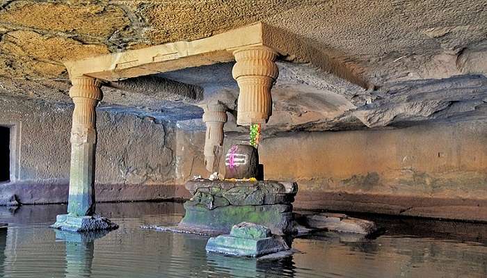 A shiva linga situated at the centre of the cave above the cold water.