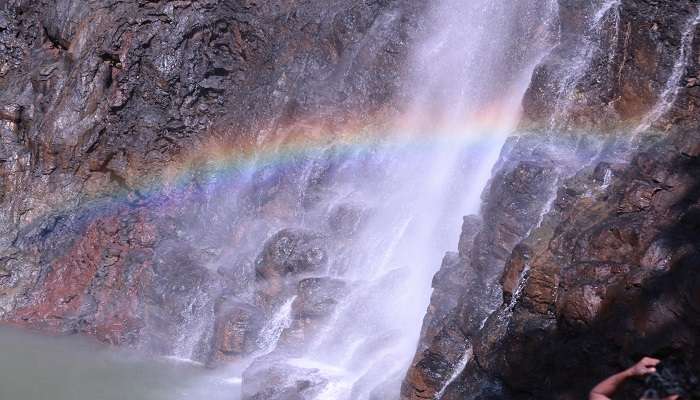 Khandadhar Waterfall with a mesmerising rainbow gracing its majestic cascade, one of the renowned picnic spots in Keonjhar