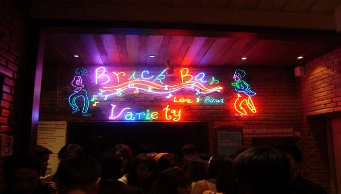 Lively bar along Khao San Road, a famous attraction near Wat Intharawihan.