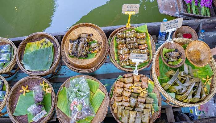 Relish the delicacies and seafood at Khlong Lat Mayom Floating Market.