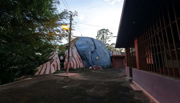A massive rock formation resembling an elephant at Kukke Subramanya Temple