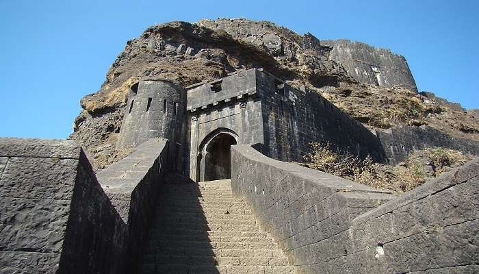 Known for its historical significance, Lohagad Fort is worth visiting on your road trip from Mumbai to Hyderabad.