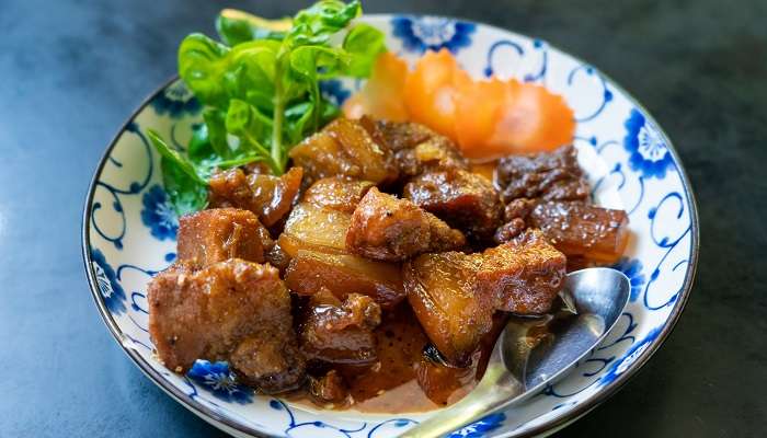 A blend of Chinese and Thai cuisine made of pork braised in brown sugar sweet soy sauce