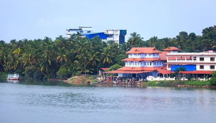 Muthappan Temple in Kerala sits along the Valapattanam riverbank.