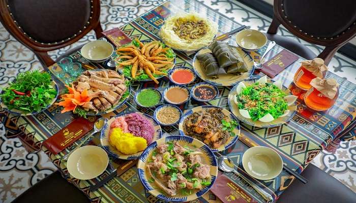 Try the local cuisine at the night market near Dragon Bridge in Vietnam