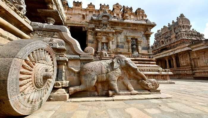 The walls of this majestic temple are adorned with beautiful carvings that narrate stories from Hindu scriptures