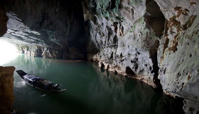 Tourist boats at the mouth of Phong Nha, one of the biggest caves in Vietnam