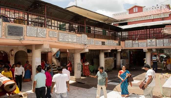 Devotees and visitors exploring through the sacred halls of Mandir.