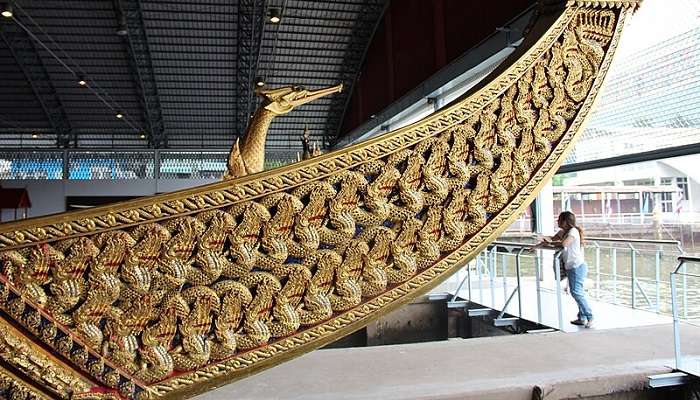 Magnificent intricate carvings of the small nagas on the barge at the Royal Barges National Museum Bangkok