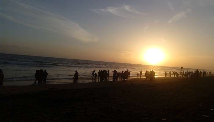 People enjoying the sunset at Shangumugham Beach which is located near Trivandrum Shiva Temple