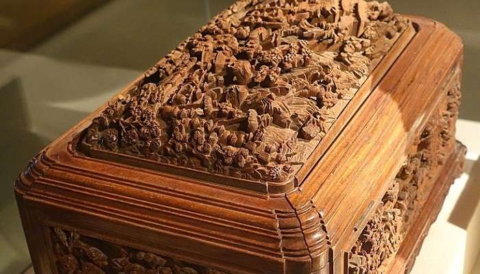Wooden carvings in a box that demonstrates the rich craft found in Hanoi.