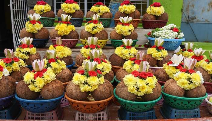 Fresh flowers, coconuts and other offerings are arranged outside the Shree Chamundeshwari Temple. 