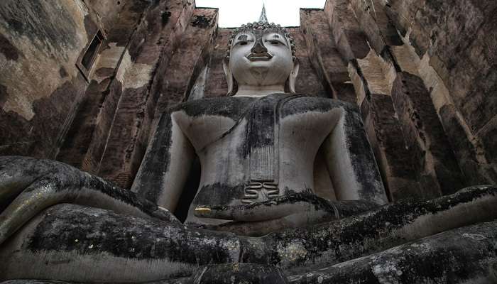 Sukhothai Wat Mahathat Buddha statues at Wat Mahathat ancient capital of Sukhothai Thailand