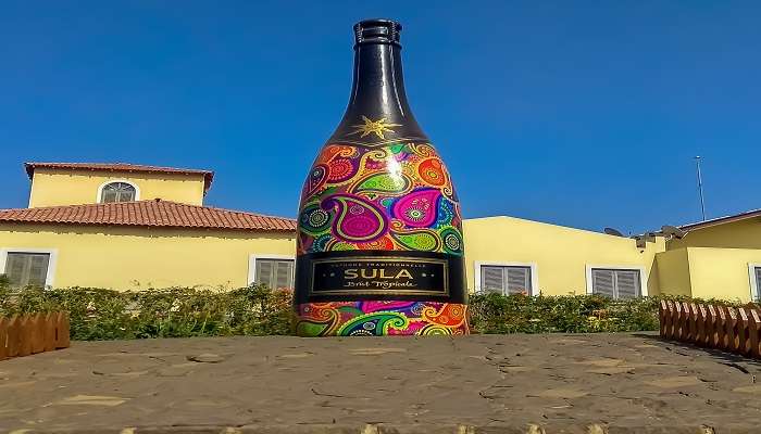 Tropicale wine bottle adorning the serene ambience of Sula Vineyards, one of the premier picnic spots in Nashik