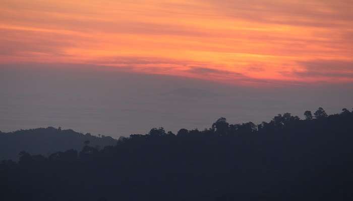 Stunning sunrise atop Tadiandamol Peak, the best place to consider embarking on trekking near Mysore.