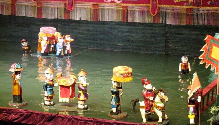 The Thang Long Water puppet show is conducted with hidden artists controlling the puppets.