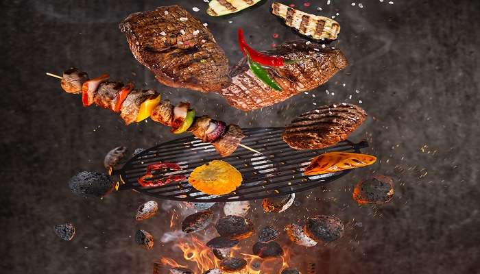 Kettle grill with hot briquettes in one of the best restaurants in Hubli. 