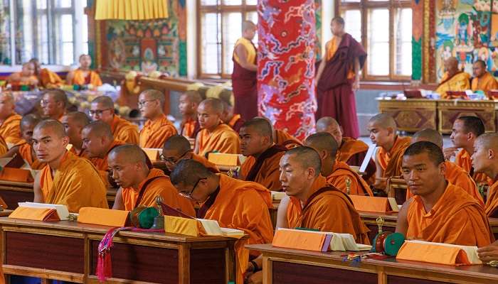 Buddhists praying in mandir.