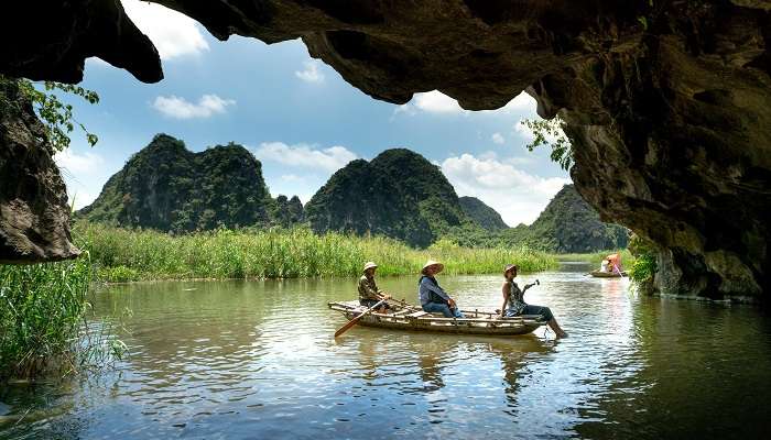 People boating In a lake of VAn Long Nature Reserve in Trang An, Vietnam