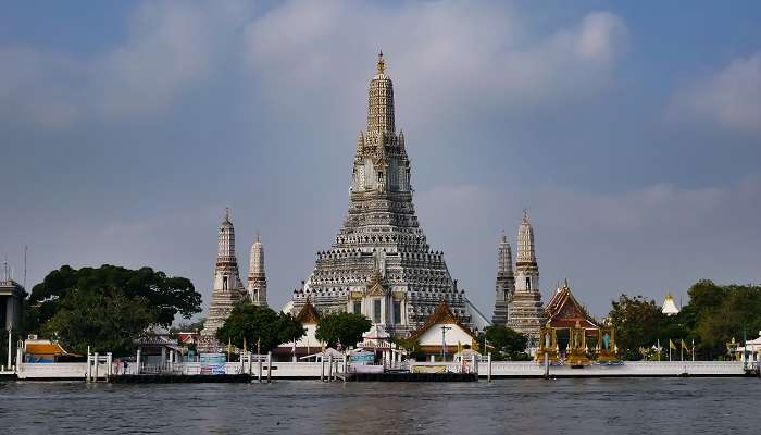 Enjoy spiritual peace at Wat Arun, top tourist place near Khlong Lat Mayom Floating Market. 
