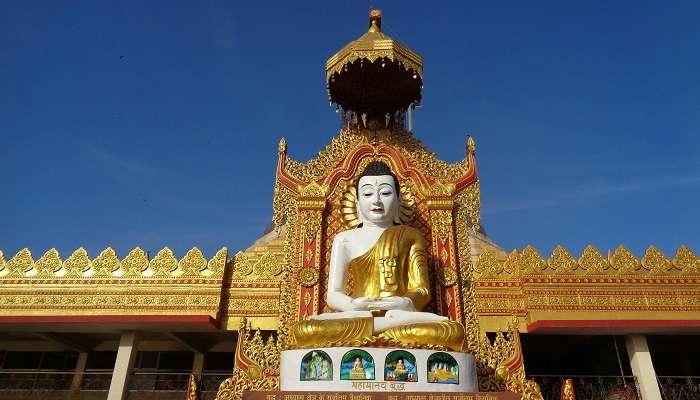 A gold Buddha statue inside this exotic place.