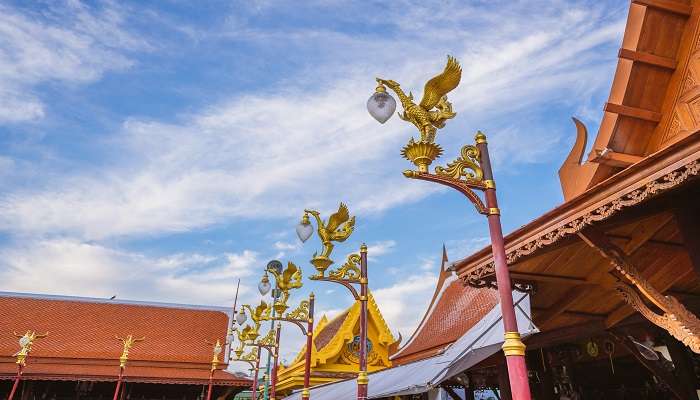 Golden Swan lamp pole inside Wat Intharawihan temple.