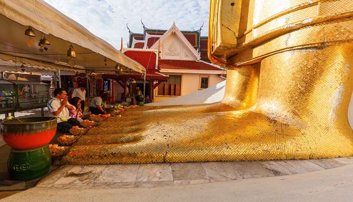 Giant feet of the Buddha Statue at Wat Intharawihan.