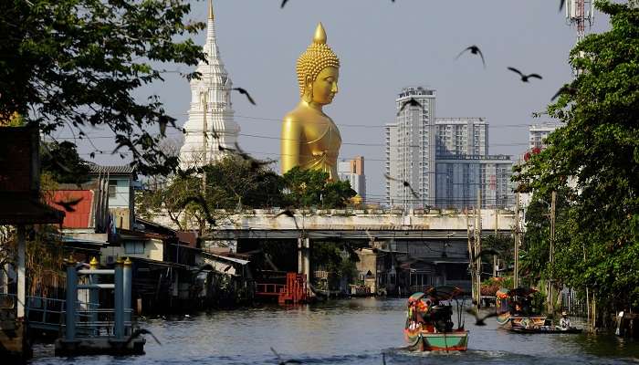 Tourists enjoying boat ride at Chao Phraya River on their vacation.