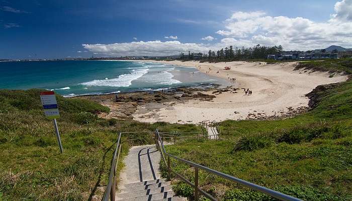 Urban vibes meet coastal charm at Wollongong City Beach during your Sydney to Melbourne road trip.