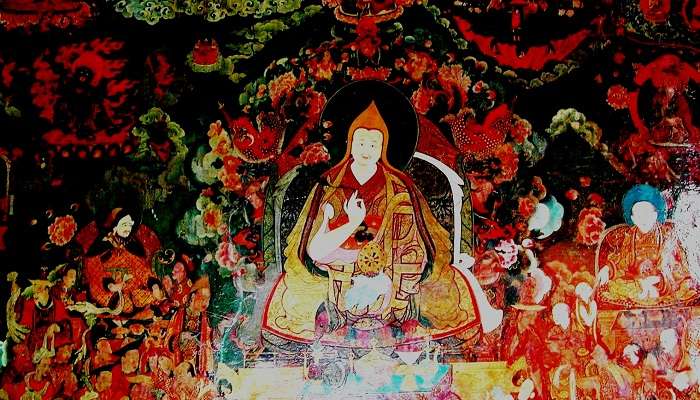 The idol of Buddha inside the main shrine of Dalai Lama temple
