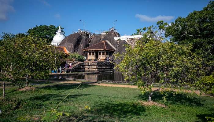 Beautiful views at the Anuradhapura Maha Viharaya with a monk overlooking sunbeam