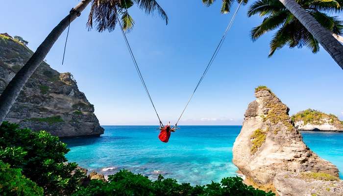 Young girl enjoying the Bali swing at Diamond Beach