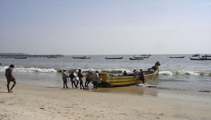 multiple fishermen at the Pleasant Beach or hotels near Thalassery.