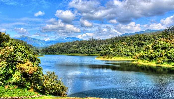 Picturesque Valaparai Lake during Valparai trekking.