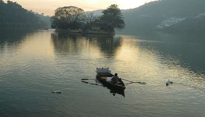 Beautiful top view of Bhimtal Lake, surrounded by lush greenery, offering a serene ambiance