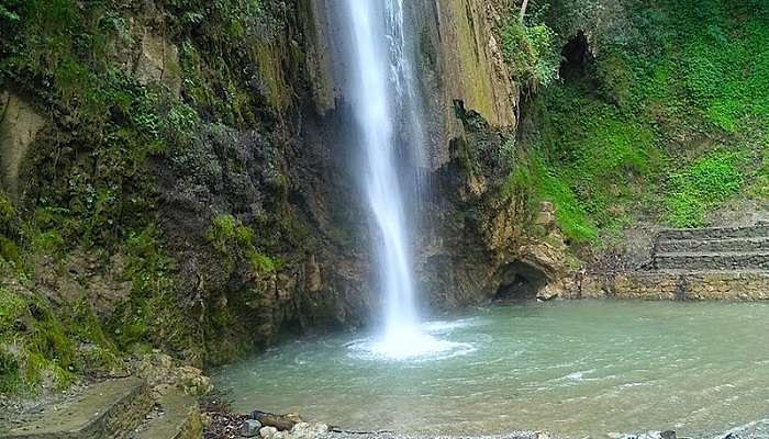 The full lush green view of Chatkara Tiger Falls